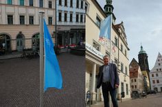 Pirnas Oberbürgermeister Tim Lochner lässt die Friedensfahne vor dem Rathaus hissen.